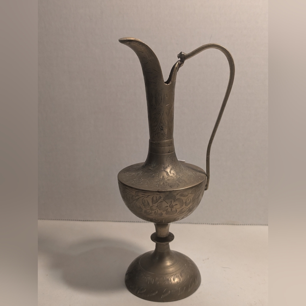 This is a vintage brass ewer or pitcher, likely crafted in India. 